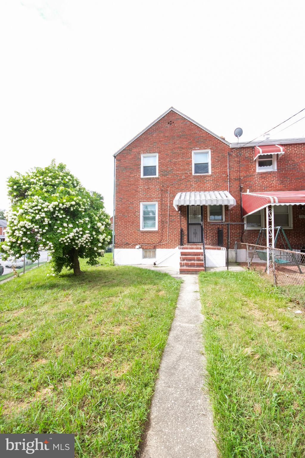 2022 Crestview Road Baltimore, MD 21239 - Photo 9 of 14 a front view of a house with a garden
