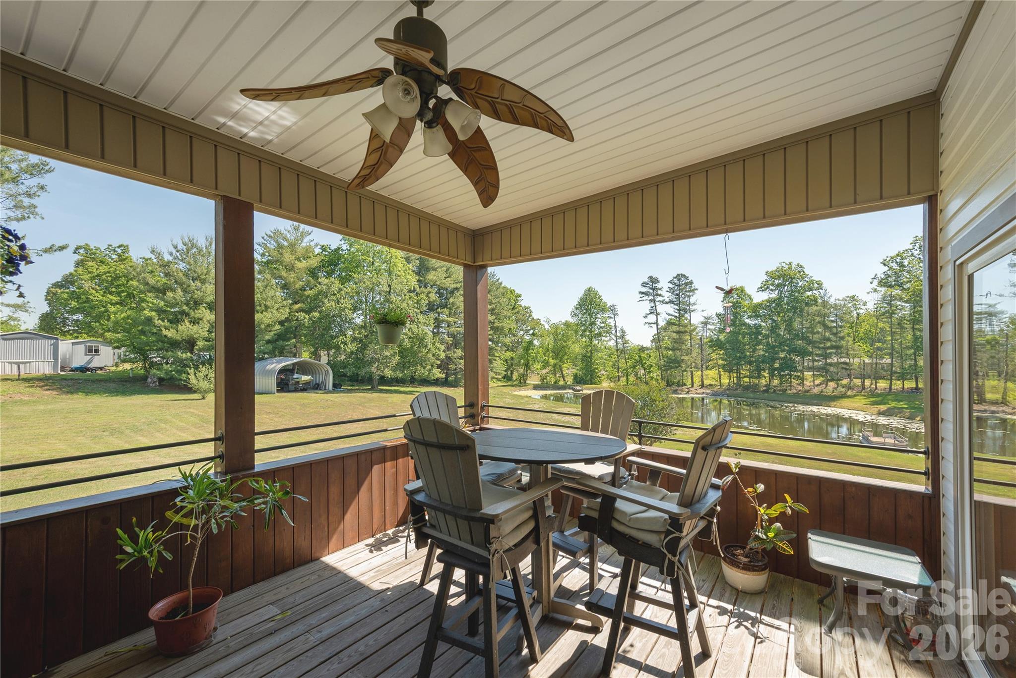 231 Allen Road East Flat Rock, NC 28726 - Photo 30 of 42 a view of a porch with furniture and wooden floor