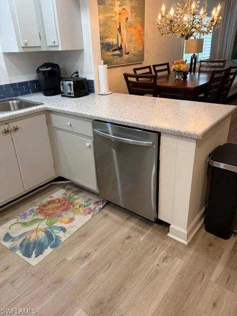 5 High Point Circle West, Unit 206 Naples, FL 34103 - Photo 38 of 39 a kitchen with a sink and cabinets