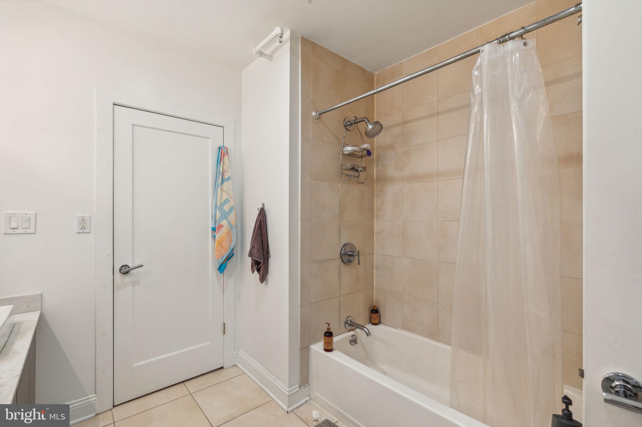 1606 Chestnut Street, Unit 3 Philadelphia, PA 19103 - Photo 13 of 21 a bathroom with a shower and a bath tub