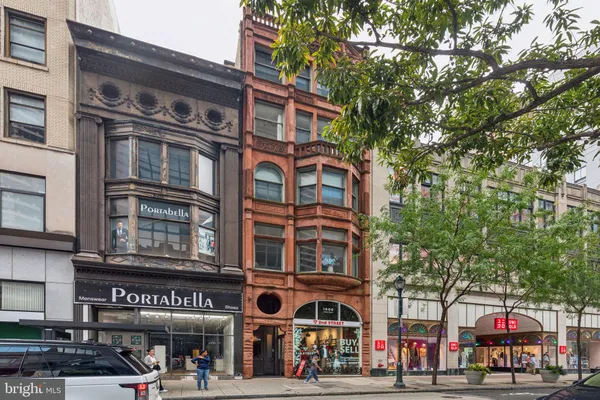 a front view of a building with street view