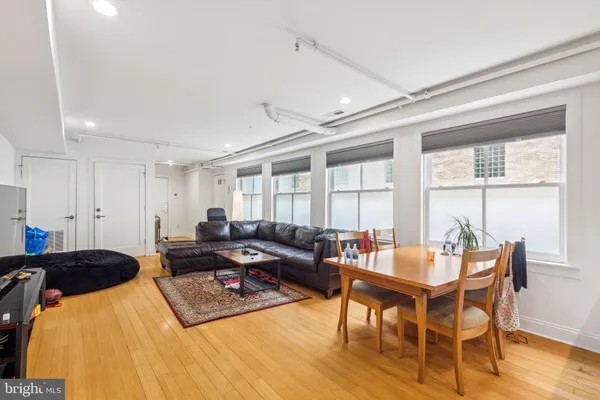 a livingroom with furniture and wooden floor