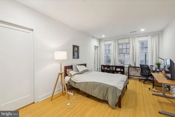 a bed room with a bed and a couch