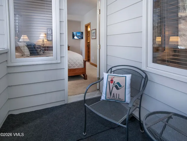 a view of a hallway with seating area