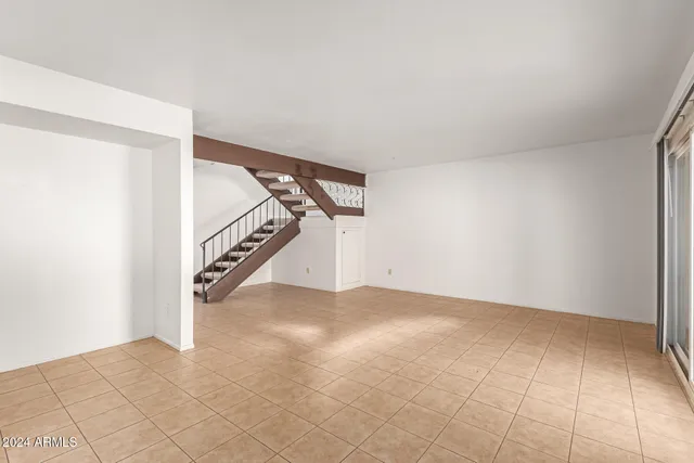 a view of a kitchen with a sink and cabinets