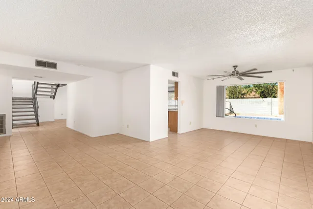a kitchen with stainless steel appliances granite countertop a sink stove and microwave