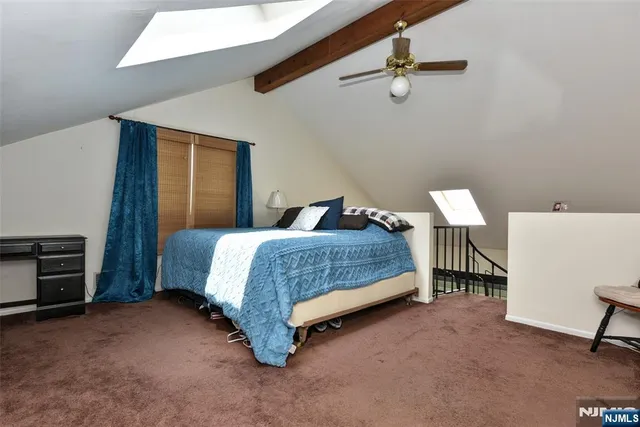 a bedroom with a bed and a table in it