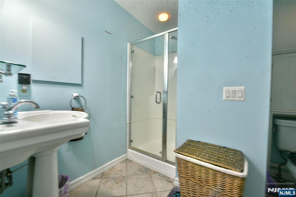4 Acapulco Princess, Unit 8 Vernon, NJ 07462 - Photo 18 of 23 a bathroom with a sink a toilet and shower