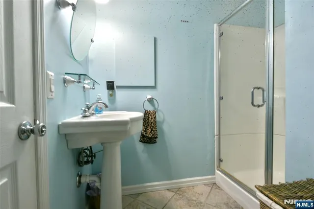 a bathroom with a sink and mirror