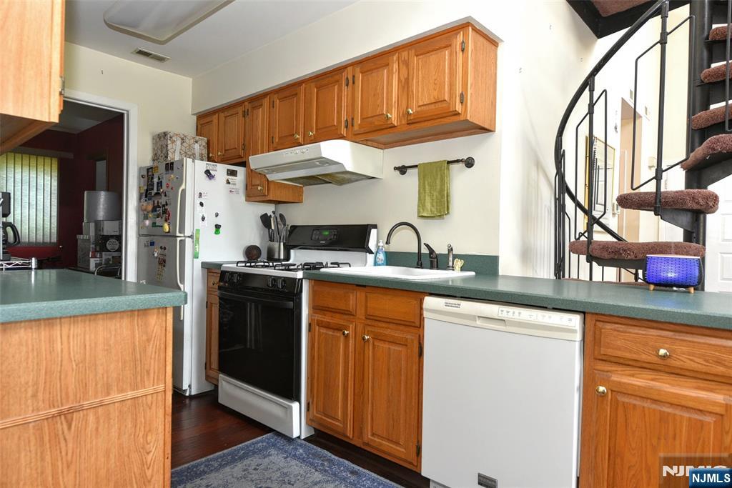 4 Acapulco Princess, Unit 8 Vernon, NJ 07462 - Photo 6 of 23 a kitchen with stainless steel appliances granite countertop a sink and a cabinets