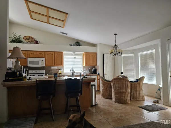 a view of a kitchen and dining room