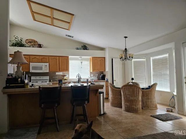 a view of a kitchen and dining room