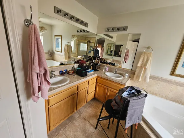 a view of a kitchen with furniture and staircase