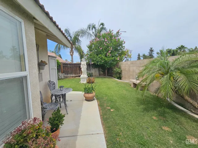 a view of yard from deck having patio
