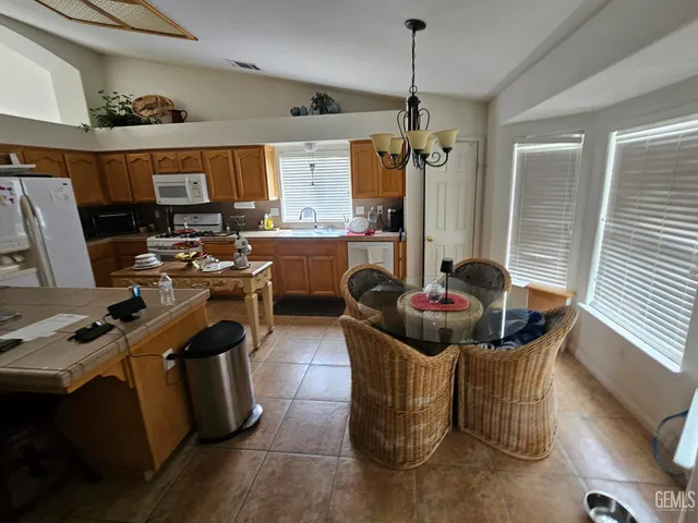 a living room with furniture a window and gym equipment
