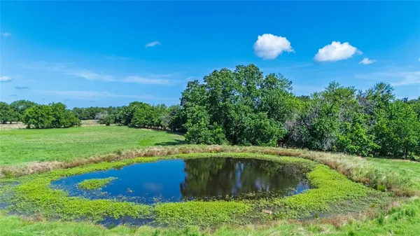 a view of a golf course with a swimming pool