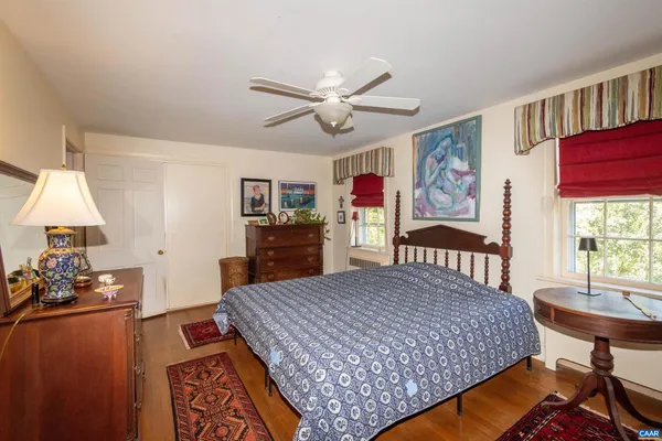 a bed room with a bed and furniture