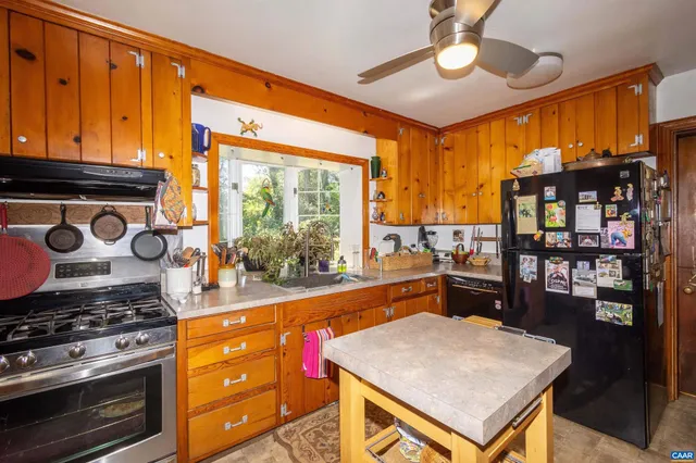 a bedroom with furniture and a book shelf