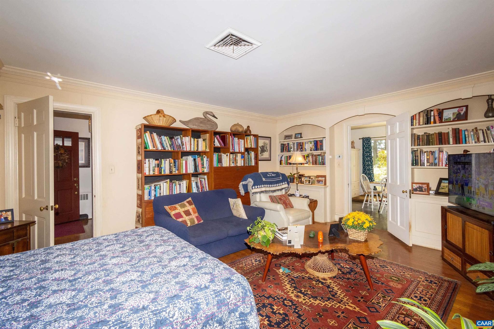 358 Main Street East Orange, VA 22960 - Photo 19 of 56 a bedroom with furniture and a book shelf