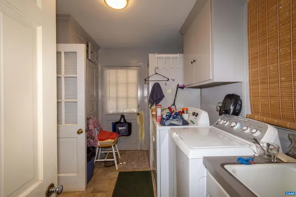 a view of a dining room with furniture wooden floor and chandelier