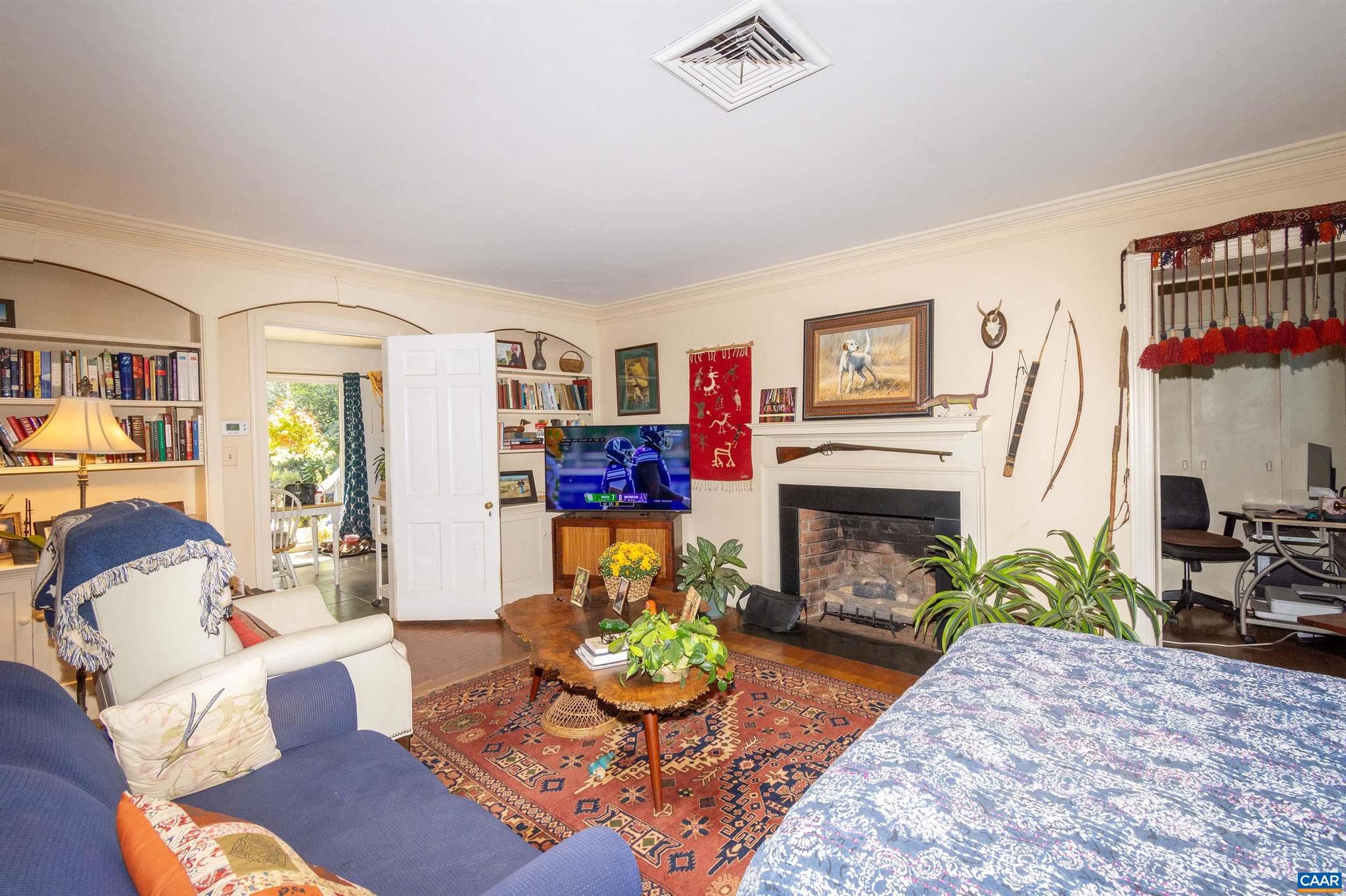 358 Main Street East Orange, VA 22960 - Photo 46 of 56 a living room with furniture a fireplace and a large window