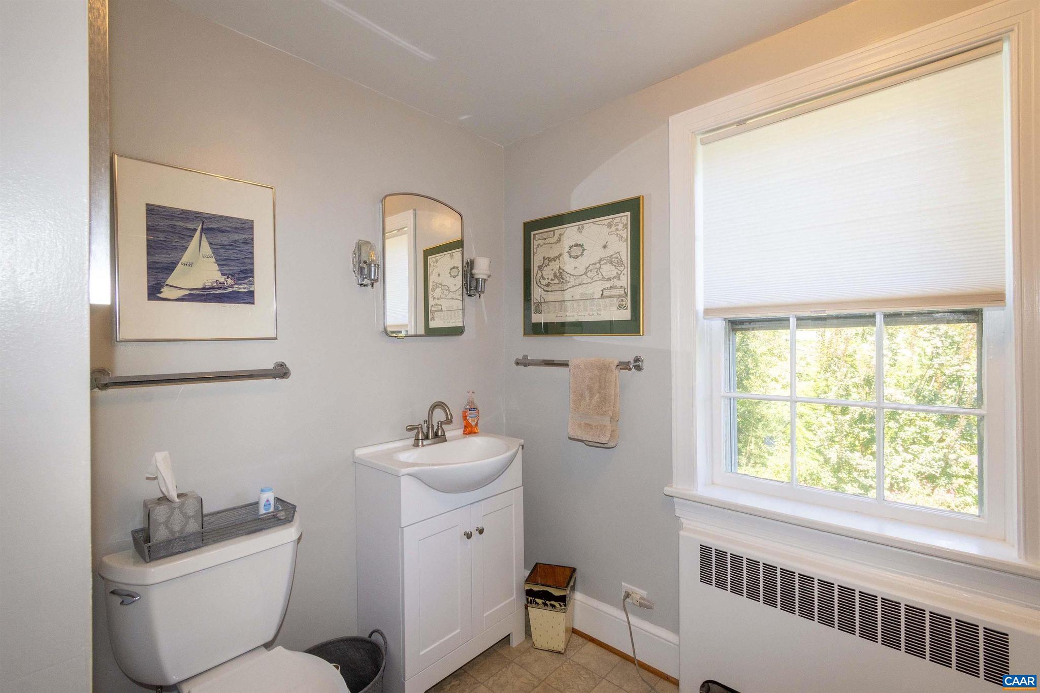 358 Main Street East Orange, VA 22960 - Photo 49 of 56 a bathroom with a toilet sink and window