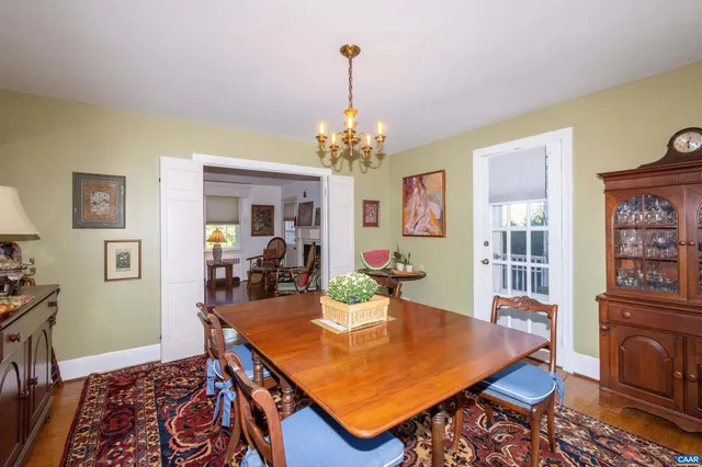 a front view of a house with a yard and fountain