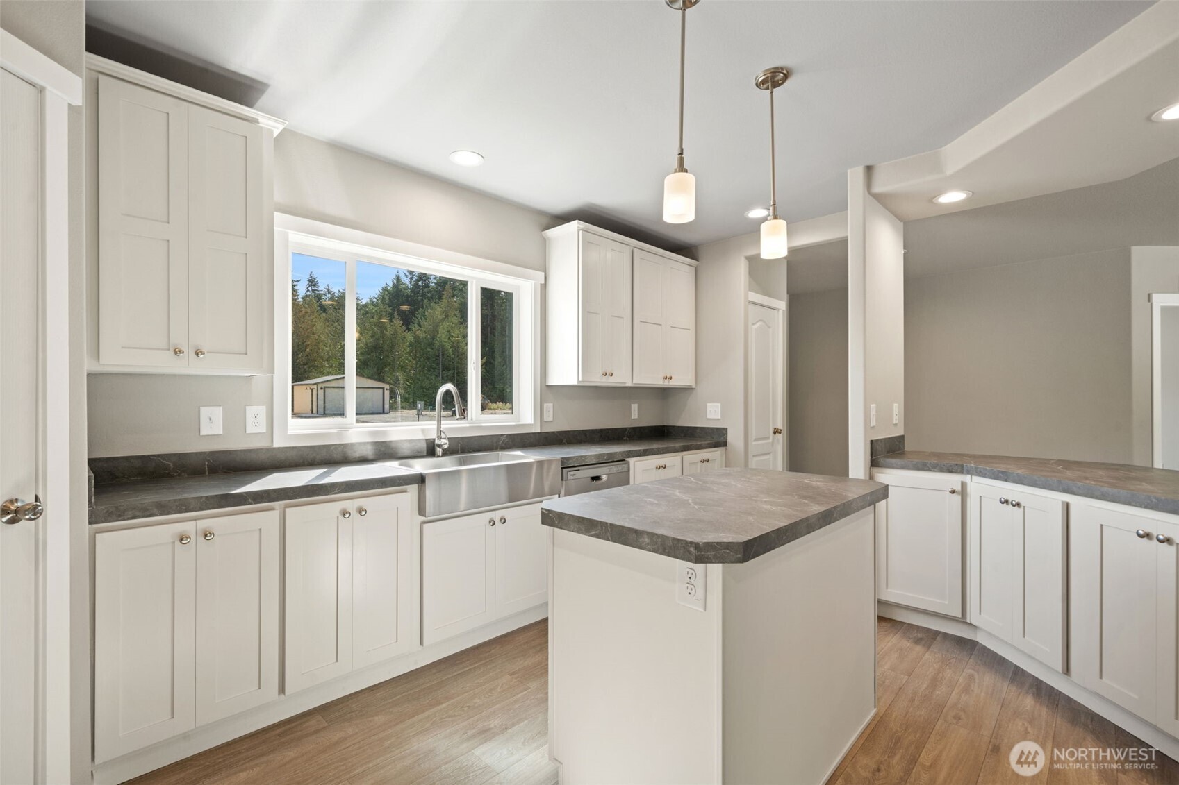 74 Butterfly Lane Sequim, WA 98382 - Photo 12 of 34 a kitchen with granite countertop a sink a counter space appliances and a window