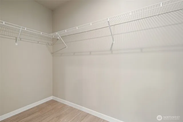 a view of a room with shelf on the wall