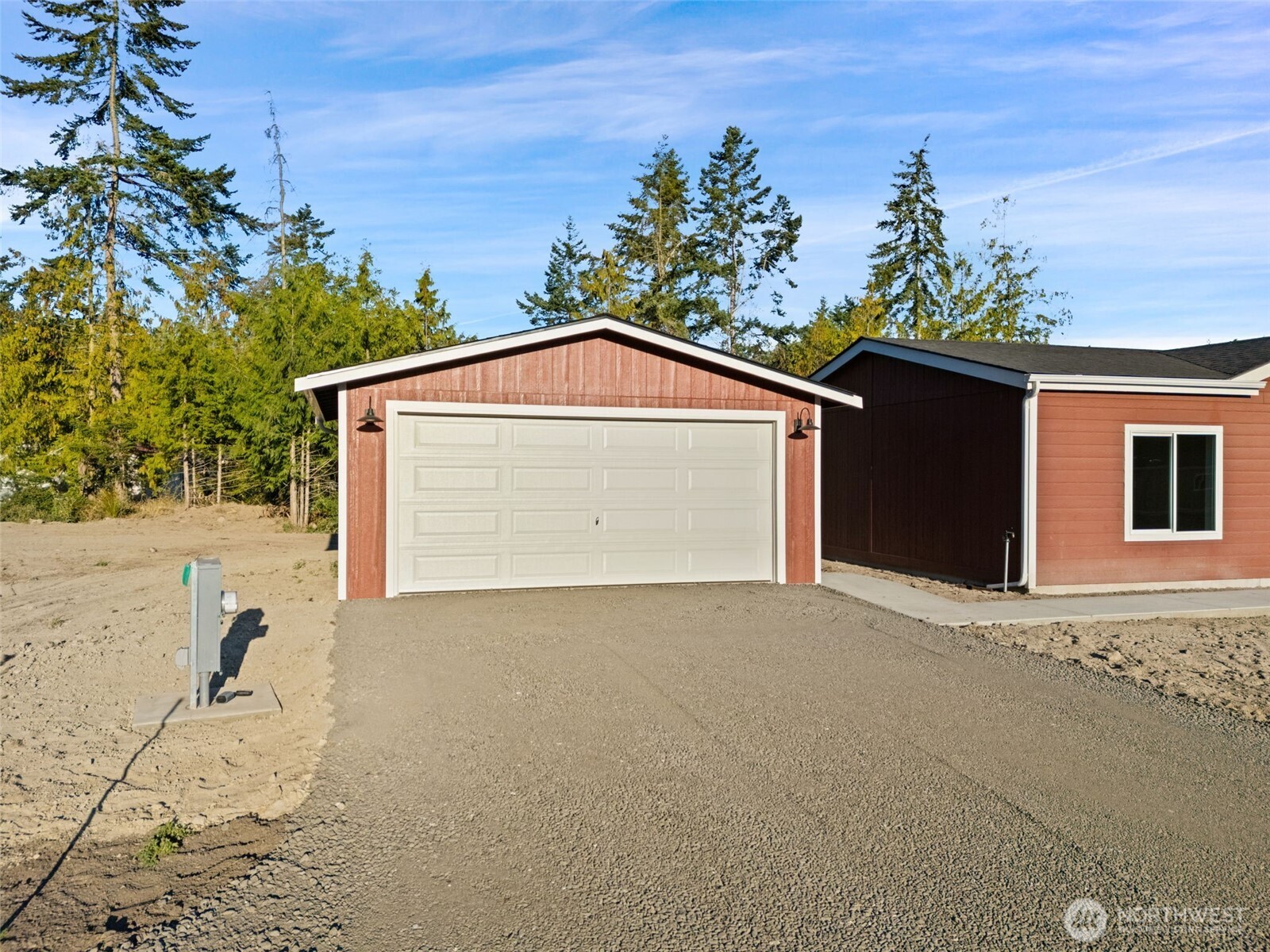 74 Butterfly Lane Sequim, WA 98382 - Photo 27 of 34 a front view of a house with a yard and garage