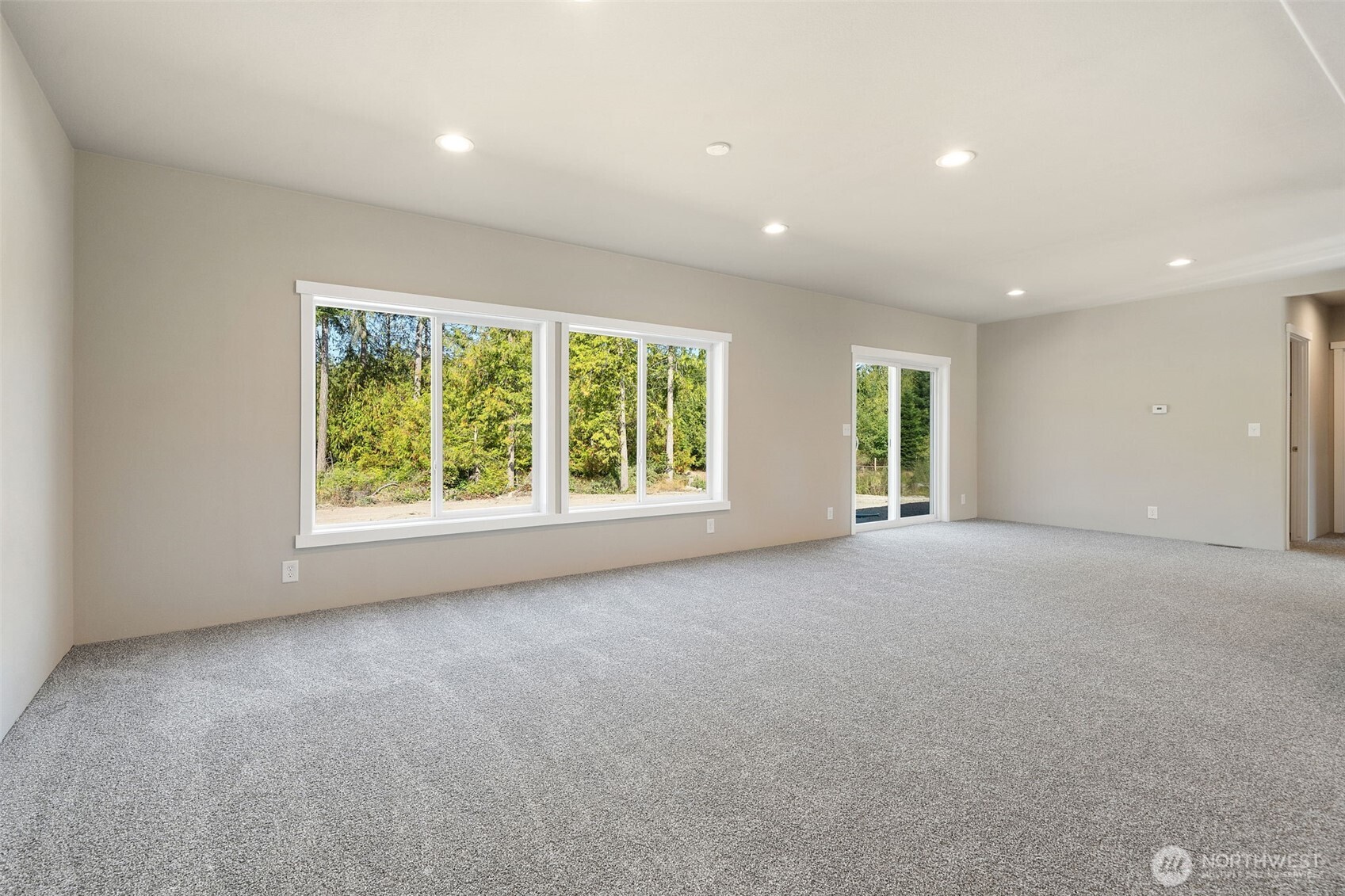 74 Butterfly Lane Sequim, WA 98382 - Photo 4 of 34 a view of a livingroom with an empty space and a window