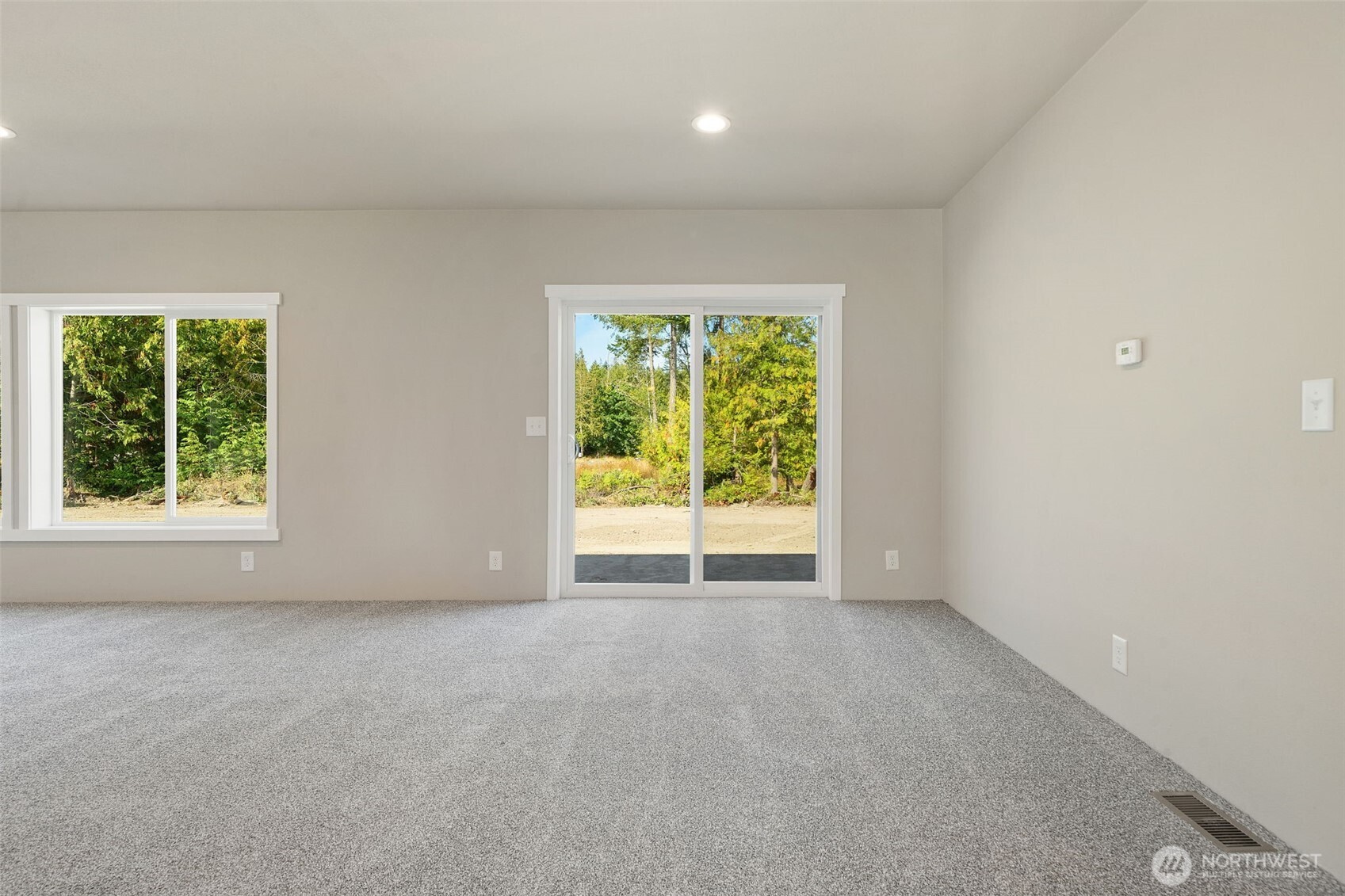 74 Butterfly Lane Sequim, WA 98382 - Photo 7 of 34 an empty room with windows