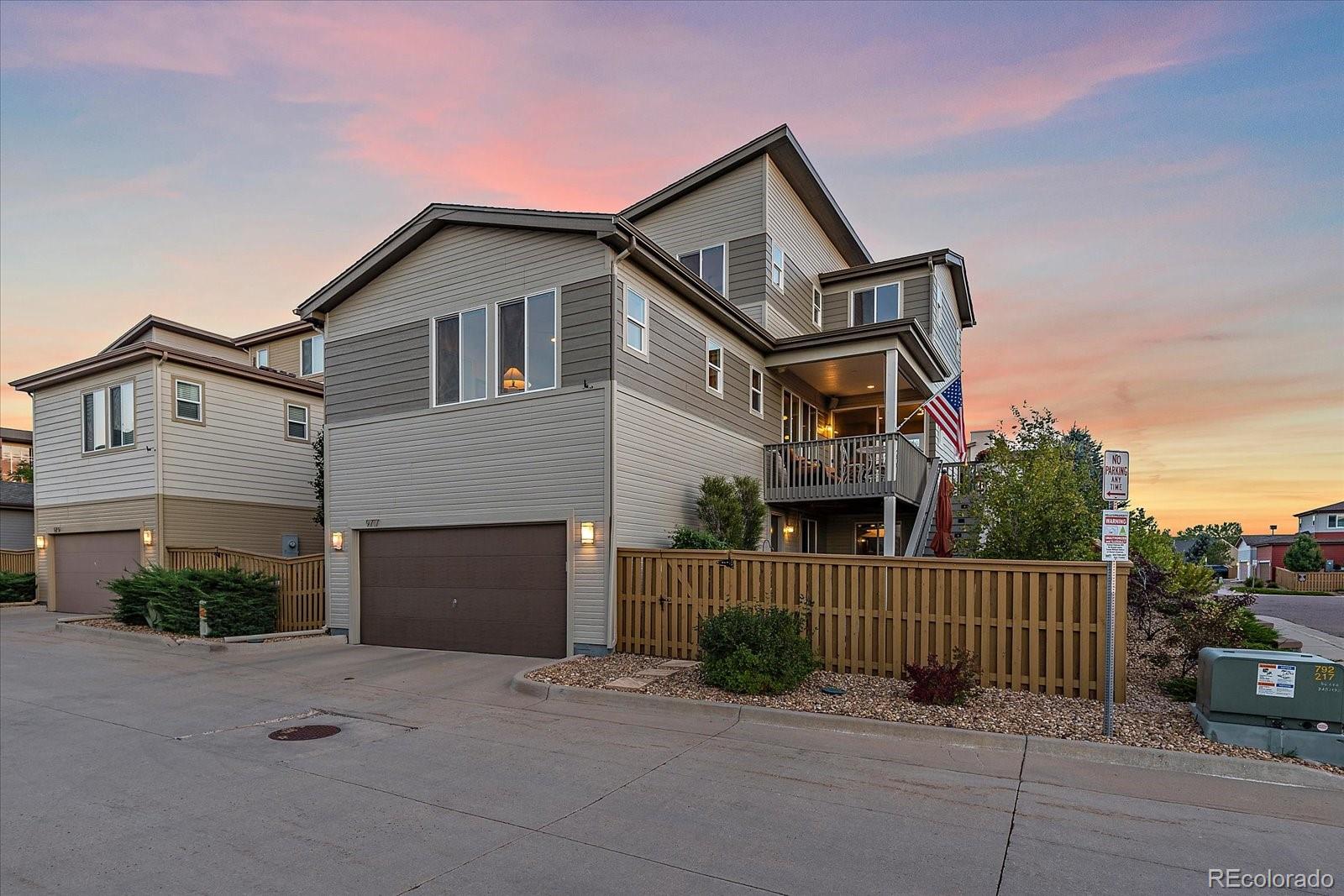 9717 Dunning Circle Highlands Ranch, CO 80126 - Photo 32 of 38 a front view of a house with a garage