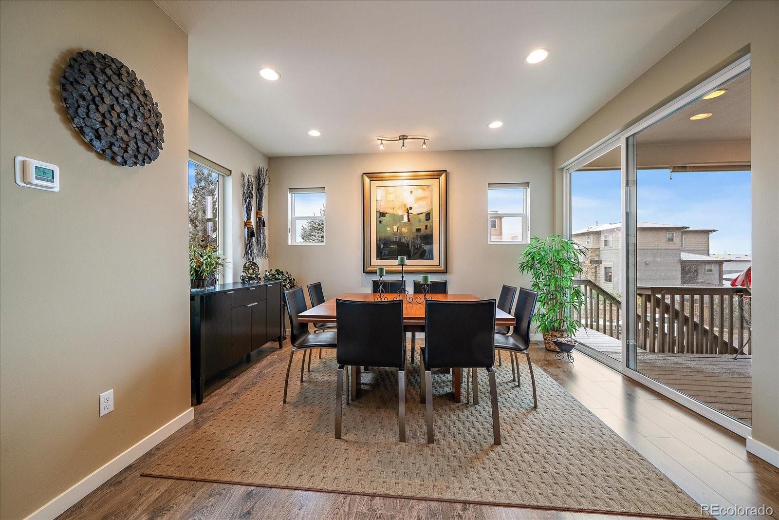 9717 Dunning Circle Highlands Ranch, CO 80126 - Photo 9 of 38 a view of a dining room with furniture