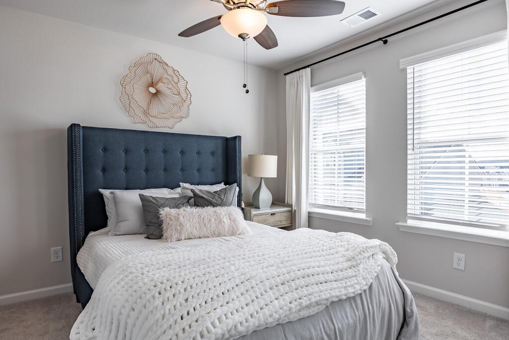 513 Kirkland Road, Unit CARRAWAY Covington, GA 30016 - Photo 12 of 53 a bedroom with a bed and a large window