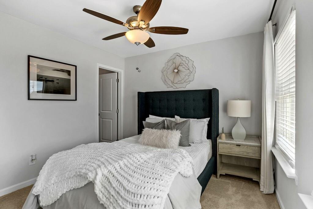 513 Kirkland Road, Unit CARRAWAY Covington, GA 30016 - Photo 35 of 53 a bedroom with a bed and a window