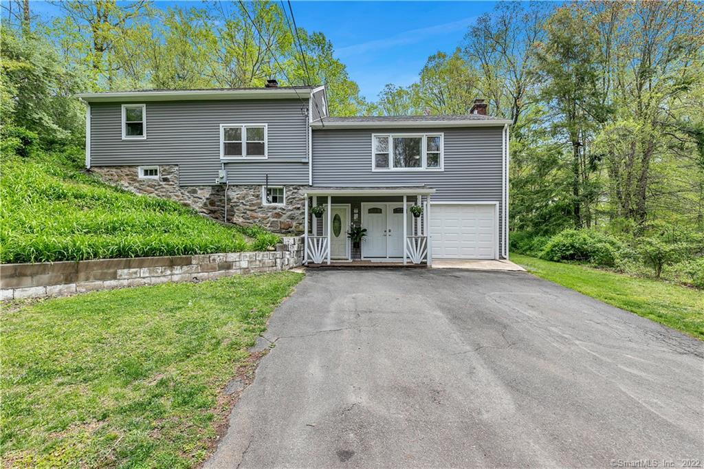 180 Durham Road Madison, CT 06443 - Photo 1 of 1 a view of house with a yard