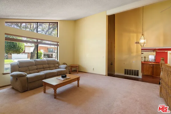 a living room with lots of furniture and dryer