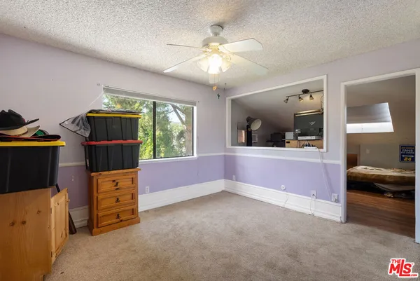 a view of a patio with a table and chairs