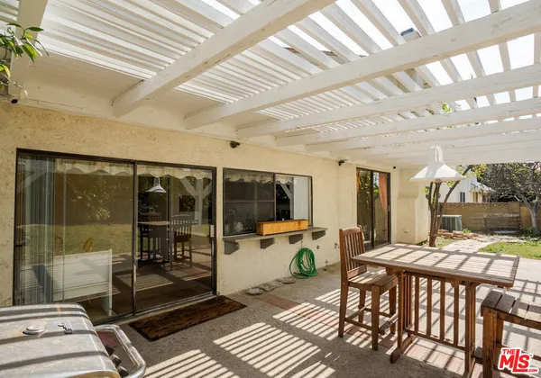 a potted plant in front of a glass door