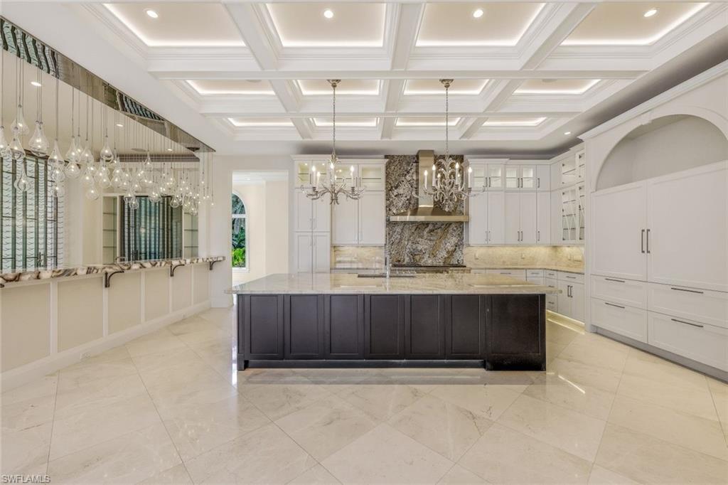 970 Aqua Circle Naples, FL 34102 - Photo 12 of 43 a view of kitchen with refrigerator and window
