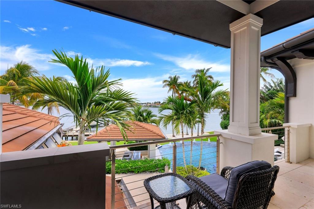 970 Aqua Circle Naples, FL 34102 - Photo 33 of 43 a view of a backyard with plants and a patio