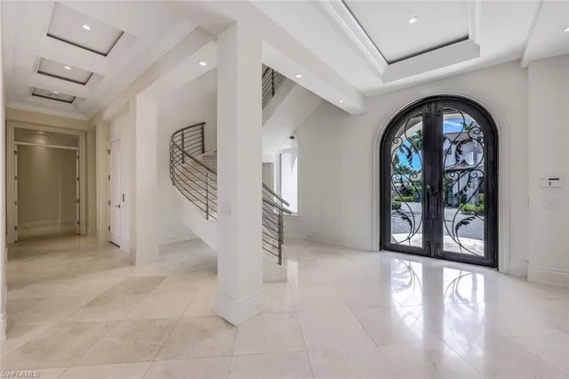 a kitchen that has a lot of cabinets and appliances