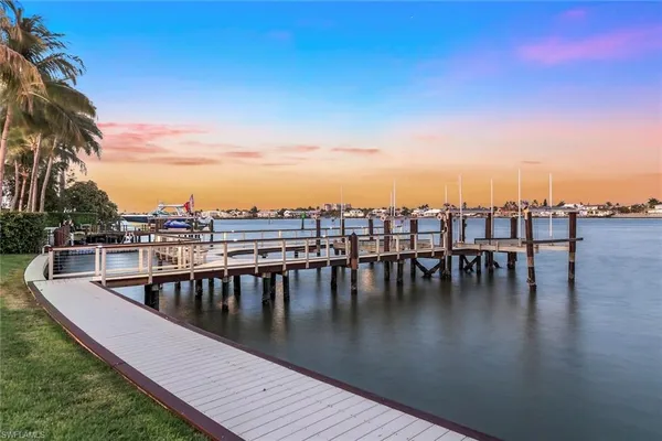 a view of swimming pool with outdoor seating