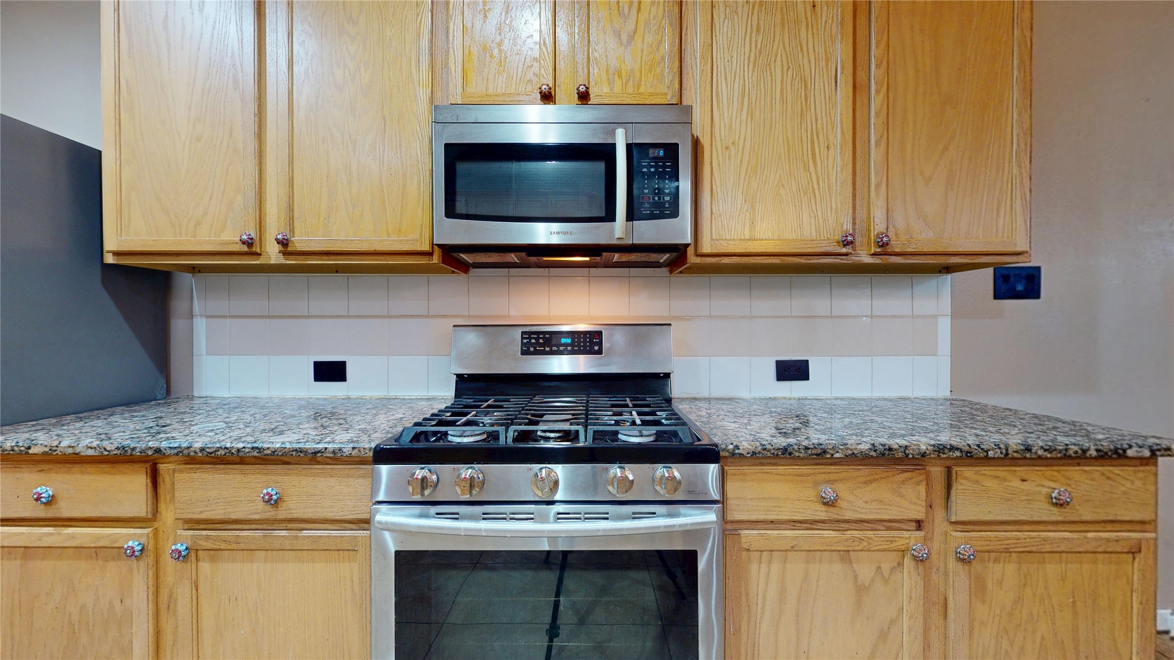 21050 Florette Lane Spring, TX 77388 - Photo 13 of 50 a kitchen with granite countertop white cabinets and stainless steel appliances