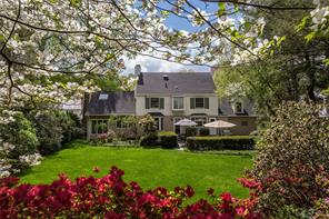 22 Birchbrook Road Bronxville, NY 10708 - Photo 1 of 1 a front view of a house with a yard and fountain