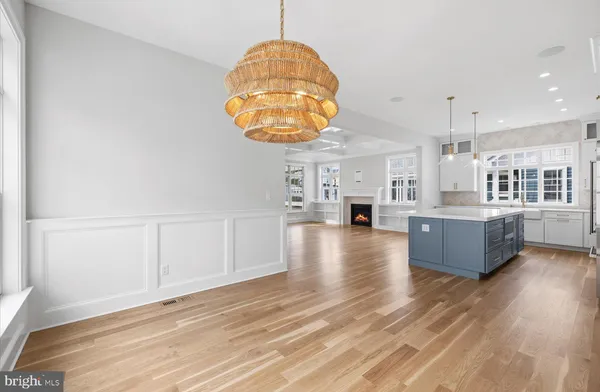 a view of kitchen with furniture and wooden floor
