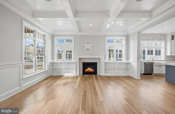 a view of a big room with windows and fireplace