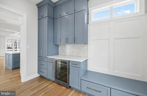 a kitchen with a stove and a white cabinet