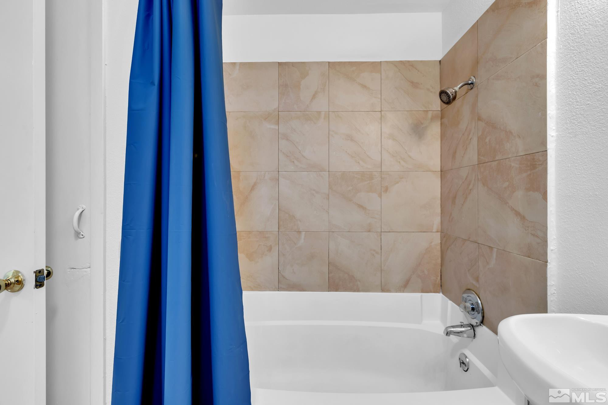2365 Patton Drive Reno, NV 89512 - Photo 12 of 20 a bathroom with a bathtub and a shower